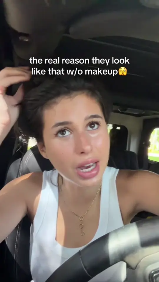 A creator in a car, no makeup, talking to camera
